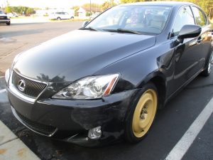 Lexus with wheel and front end damage