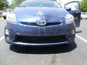 front of vehicle damaged and dirty