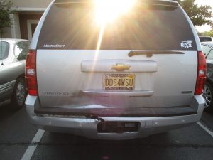 dent and damage to back of SUV