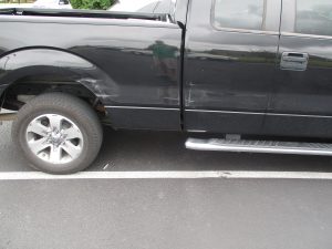 damage on side of a truck