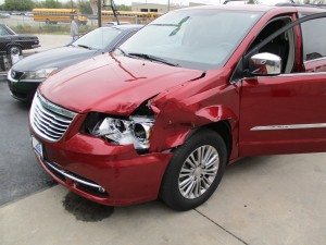 red suv damaged in car accident