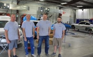 Four of the skilled auto technicians at Collision Center of Andover