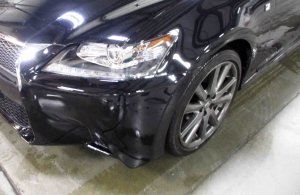 Small vehicle damage to the front of a 2015 Lexus.