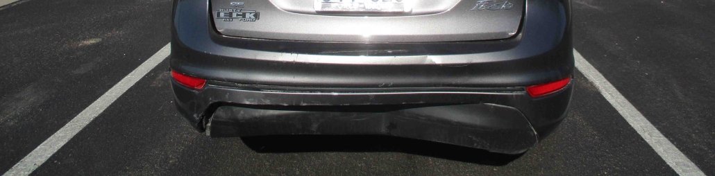 Bumper dented on the back of a 2014 Ford Fiesta, repaired at Collision Center of Andover