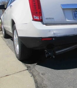Fender bender damage done to the back of a 2011 white cadillac, taken in for repairs to Collision Center of Andover.