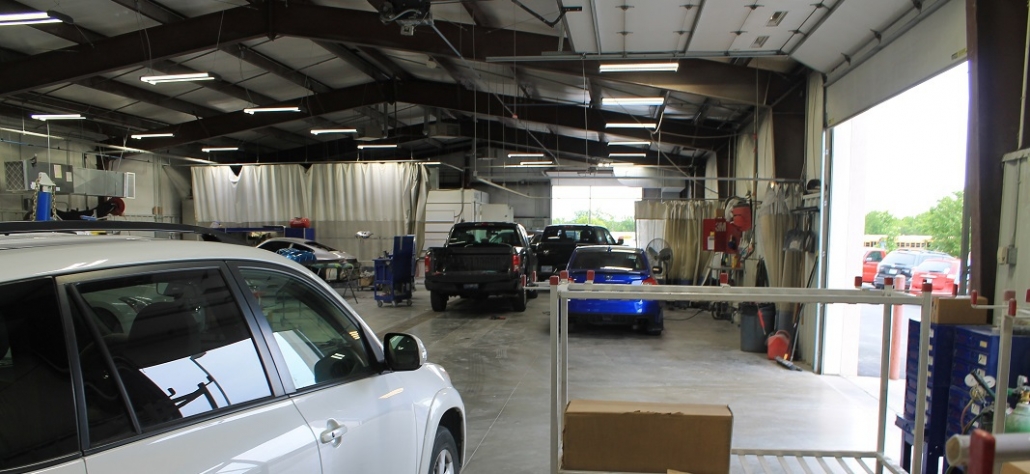 Inside look at auto body shop providing paintless dent repair service and more