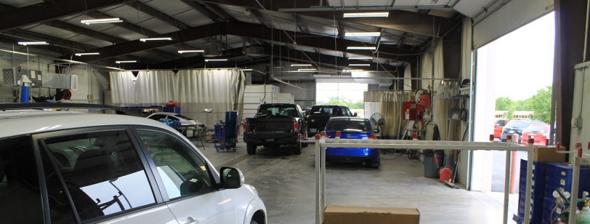 Inside look at auto body shop providing paintless dent repair service and more