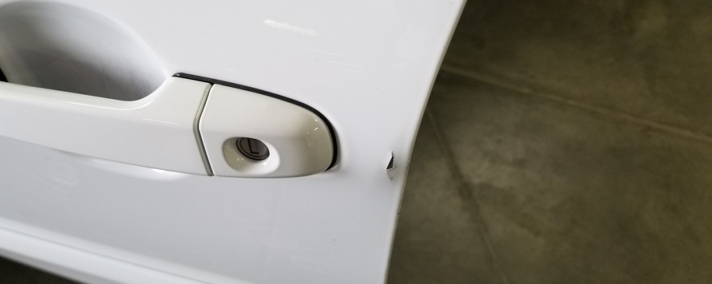 White car door damaged by handle, repair time to expect
