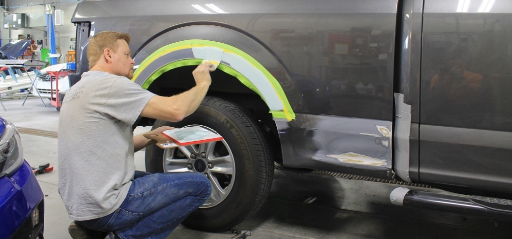 Auto body shop near Wichita where mechanic repaints gray truck